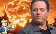 Phil Spencer crying as a Fallout 76 Nuke explodes behind him; Vault Boy stands to the side giving the Xbox boss a “thumbs down”