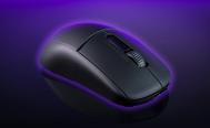 A black wireless gaming mouse with a purple glow around it in front of a darker purple background.